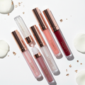 Luxury lip gloss wand collection in rose gold and white packaging